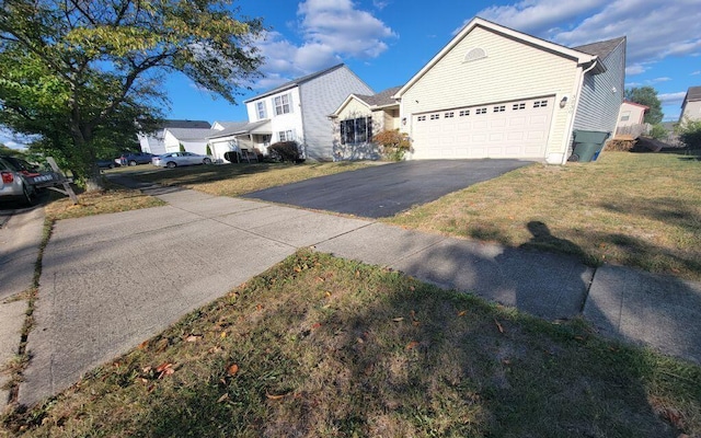3230 Saint Bernard Cir, Columbus, OH 43232 - traditional-style house featuring asphalt driveway, a garage, and a front lawn