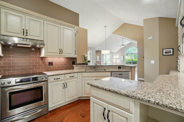 4298 Bridgeside Pl, New Albany, OH 43054 - kitchen featuring cream cabinets, under cabinet range hood, stainless steel appliances, a peninsula, and a sink