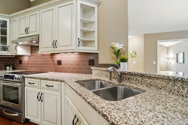 4298 Bridgeside Pl, New Albany, OH 43054 - kitchen featuring stainless steel range with electric cooktop, under cabinet range hood, a sink, light stone countertops, and tasteful backsplash