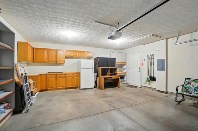 4298 Bridgeside Pl, New Albany, OH 43054 - garage with freestanding refrigerator and electric panel