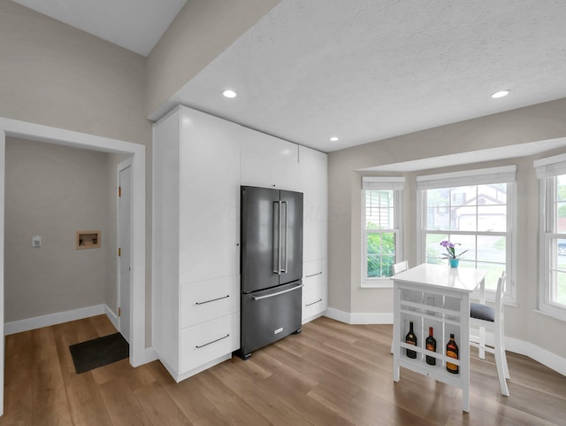 2908 Torrey Pines Dr, Pickerington, OH 43147 - kitchen with high end refrigerator, baseboards, light wood-type flooring, white cabinets, and recessed lighting