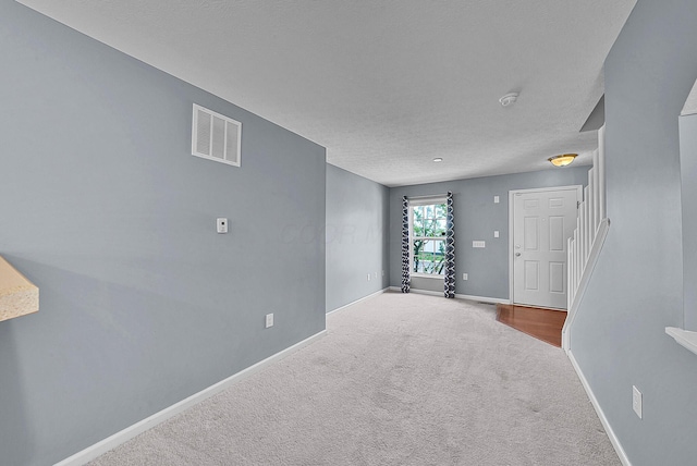5801 Bridgehampton Dr, New Albany, OH 43054 - empty room with carpet floors, a textured ceiling, and a smoke detector
