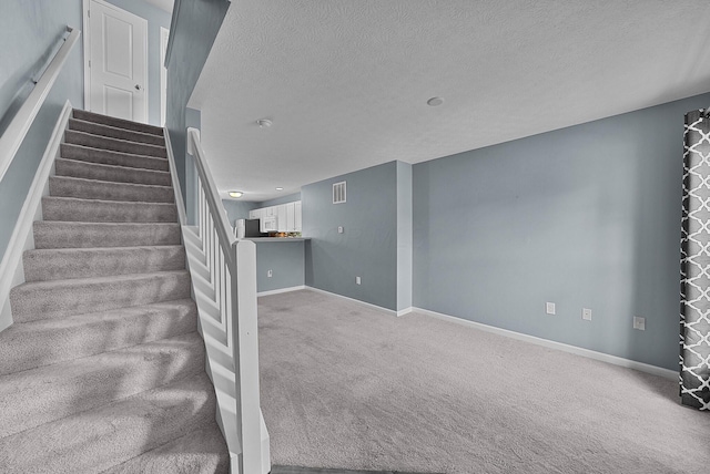 5801 Bridgehampton Dr, New Albany, OH 43054 - stairway with a textured ceiling and carpet