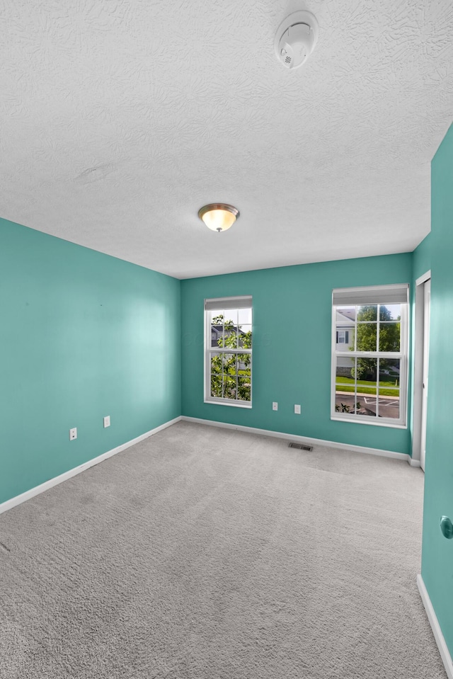 5801 Bridgehampton Dr, New Albany, OH 43054 - carpeted spare room with a smoke detector and a textured ceiling