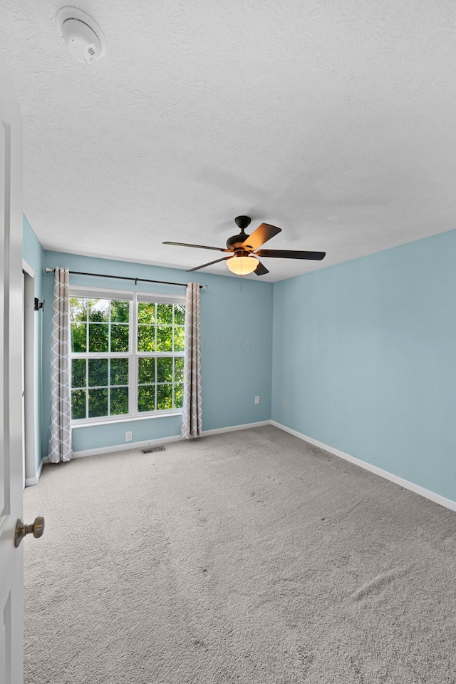 5801 Bridgehampton Dr, New Albany, OH 43054 - spare room with a ceiling fan, a textured ceiling, and carpet floors