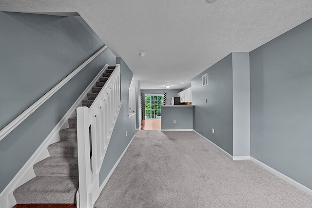 5801 Bridgehampton Dr, New Albany, OH 43054 - stairway with carpet and a textured ceiling