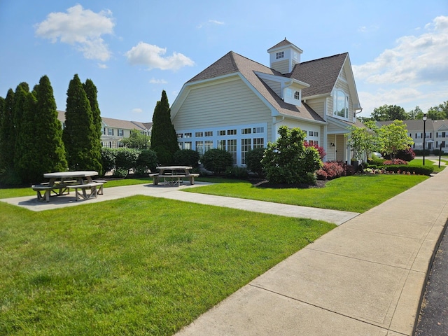5801 Bridgehampton Dr, New Albany, OH 43054 - view of side of property featuring a yard and roof with shingles
