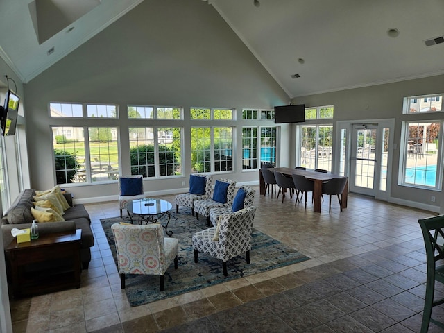 5801 Bridgehampton Dr, New Albany, OH 43054 - living room featuring high vaulted ceiling, ornamental molding, and stone tile flooring