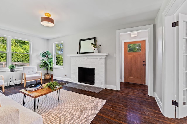 1271 Moundview Ave, Columbus, OH 43207 - living room featuring wood-type flooring, baseboards, and a fireplace