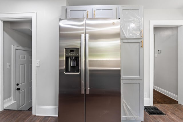 1271 Moundview Ave, Columbus, OH 43207 - kitchen featuring stainless steel refrigerator with ice dispenser, baseboards, and dark wood-style floors