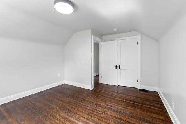 1271 Moundview Ave, Columbus, OH 43207 - additional living space featuring lofted ceiling, baseboards, and dark wood-style flooring