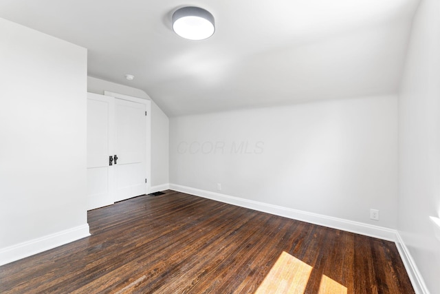 1271 Moundview Ave, Columbus, OH 43207 - bonus room featuring baseboards, lofted ceiling, and dark wood-style flooring
