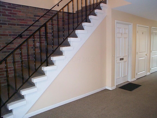 652 Olde Towne Ave Unit E, Columbus, OH 43214 - staircase featuring carpet flooring and baseboards
