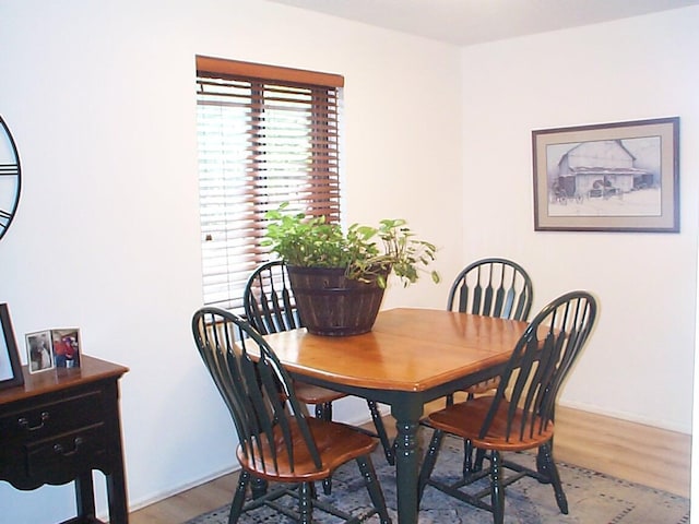 652 Olde Towne Ave Unit E, Columbus, OH 43214 - dining room with light wood-style flooring and baseboards