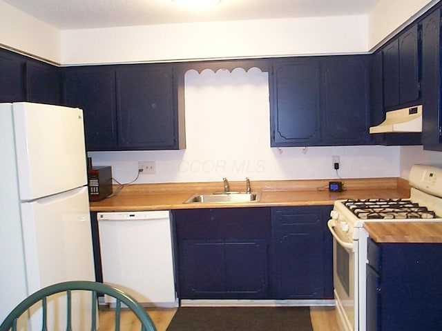 652 Olde Towne Ave Unit E, Columbus, OH 43214 - kitchen featuring white appliances, a sink, under cabinet range hood, light countertops, and blue cabinets