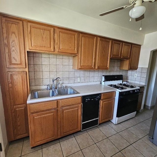 2325 E Livingston Ave, Columbus, OH 43209 - kitchen featuring range with gas cooktop, dishwasher, a sink, light countertops, and backsplash
