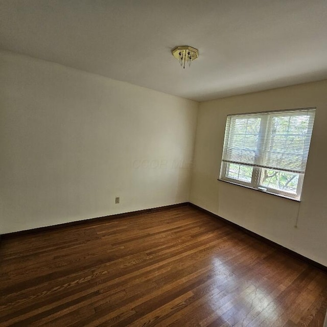 2325 E Livingston Ave, Columbus, OH 43209 - empty room with dark wood-style floors and baseboards