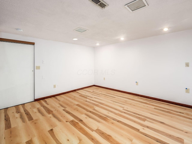 873 Soramill Ln Unit 4B, Columbus, OH 43085 - spare room featuring light wood-type flooring, baseboards, recessed lighting, and a smoke detector