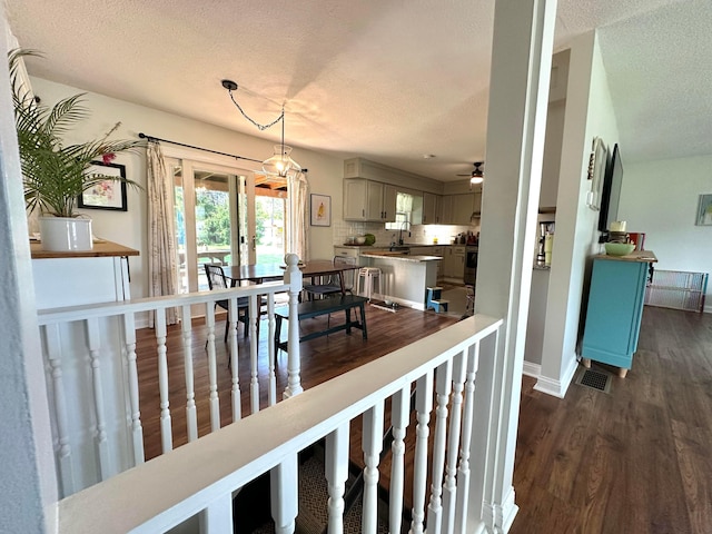 128 Ivy St, Newark, OH 43055 - dining area with a textured ceiling, dark wood-style floors, baseboards, and ceiling fan