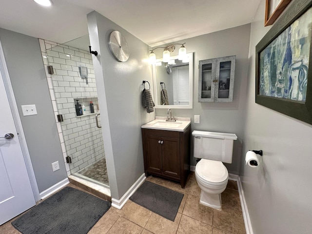 128 Ivy St, Newark, OH 43055 - full bath featuring baseboards, a stall shower, vanity, toilet, and tile patterned flooring