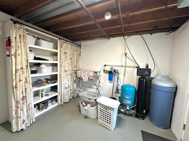 128 Ivy St, Newark, OH 43055 - unfinished basement with a water pressure tank, a water softener, and concrete block wall