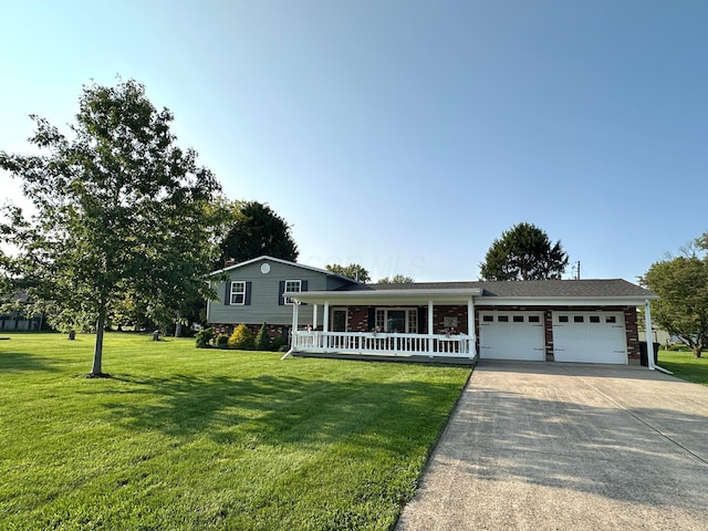128 Ivy St, Newark, OH 43055 - tri-level home with an attached garage, driveway, a front yard, and covered porch