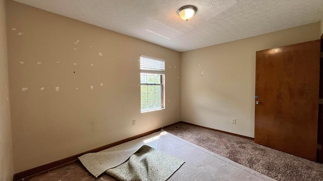 624 Village Park Dr, Powell, OH 43065 - carpeted spare room featuring baseboards and a textured ceiling