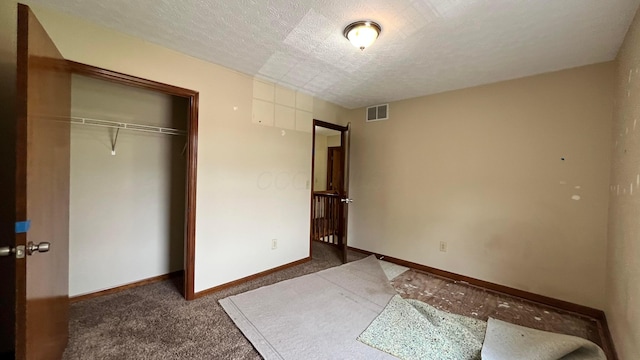 624 Village Park Dr, Powell, OH 43065 - unfurnished bedroom featuring a textured ceiling, carpet flooring, and a closet