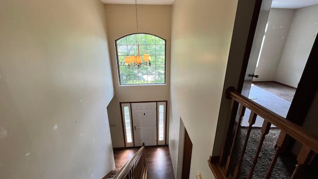 624 Village Park Dr, Powell, OH 43065 - foyer entrance featuring a high ceiling, a chandelier, and dark wood-style flooring
