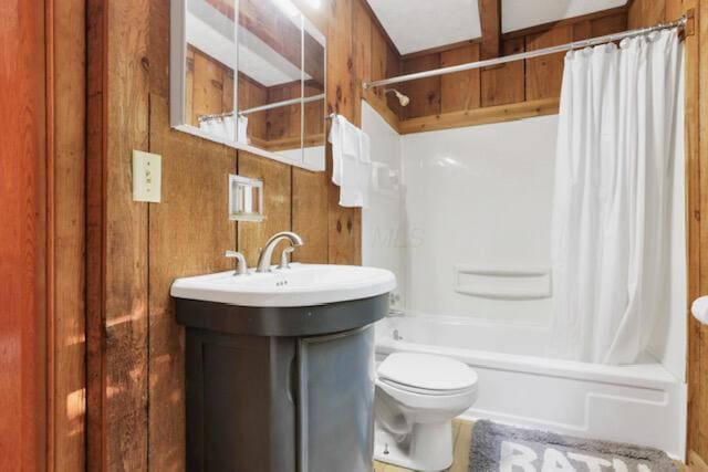 1275 Taos Ln, Sugar Grove, OH 43155 - bathroom featuring shower / bathtub combination with curtain, toilet, vanity, and wooden walls