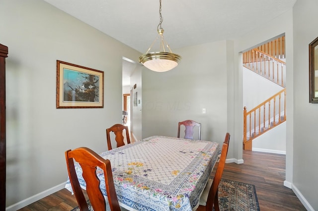 583 Marhurst Ct, Galloway, OH 43119 - dining room featuring dark wood finished floors, stairway, and baseboards