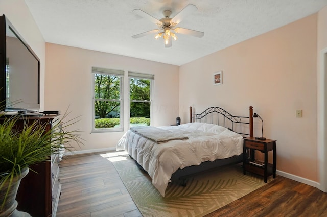 583 Marhurst Ct, Galloway, OH 43119 - bedroom with baseboards, wood finished floors, and a ceiling fan