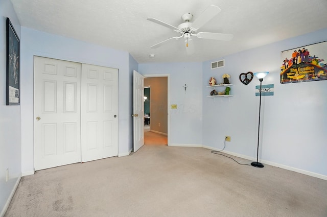 583 Marhurst Ct, Galloway, OH 43119 - unfurnished bedroom with light colored carpet, baseboards, a closet, and ceiling fan