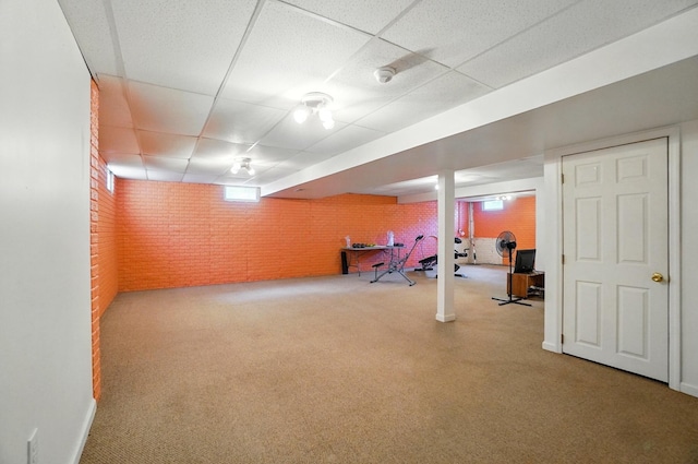 583 Marhurst Ct, Galloway, OH 43119 - basement with brick wall, a drop ceiling, and carpet flooring