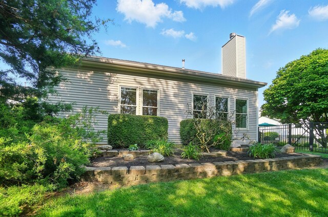 583 Marhurst Ct, Galloway, OH 43119 - view of side of home with a chimney