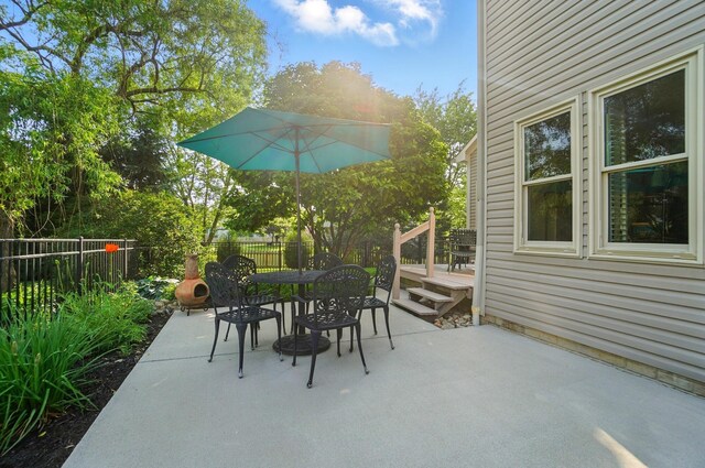 583 Marhurst Ct, Galloway, OH 43119 - fenced backyard featuring outdoor dining area, a patio area, and a wooden deck