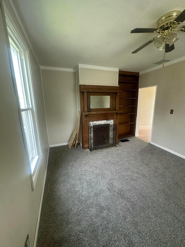 600 N Maple St, Lancaster, OH 43130 - unfurnished living room with baseboards, ceiling fan, crown molding, and carpet flooring