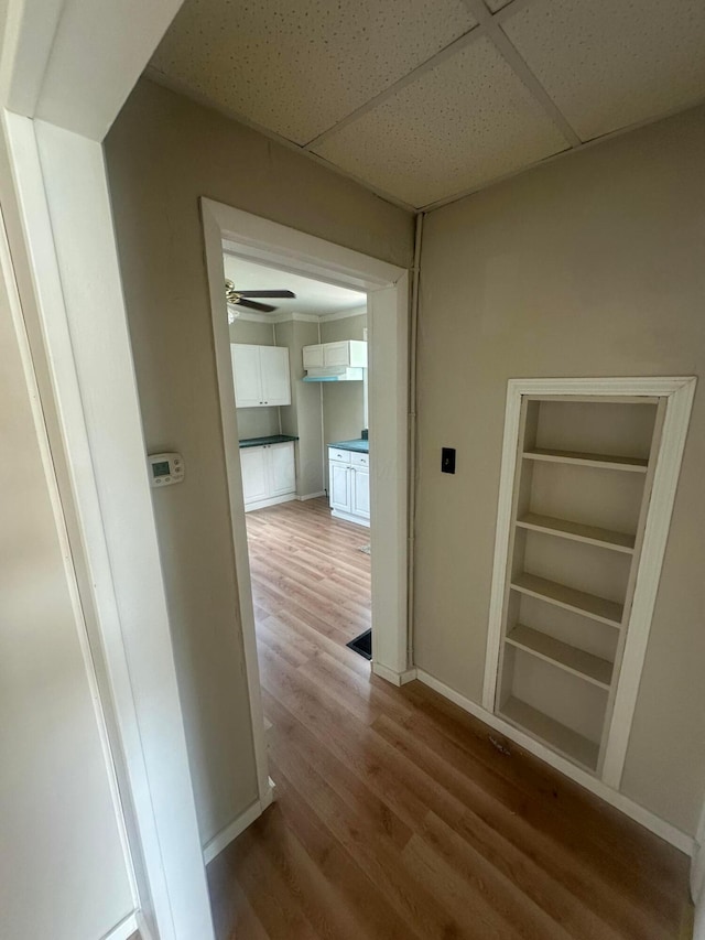 600 N Maple St, Lancaster, OH 43130 - corridor featuring light wood-style flooring, a drop ceiling, and baseboards