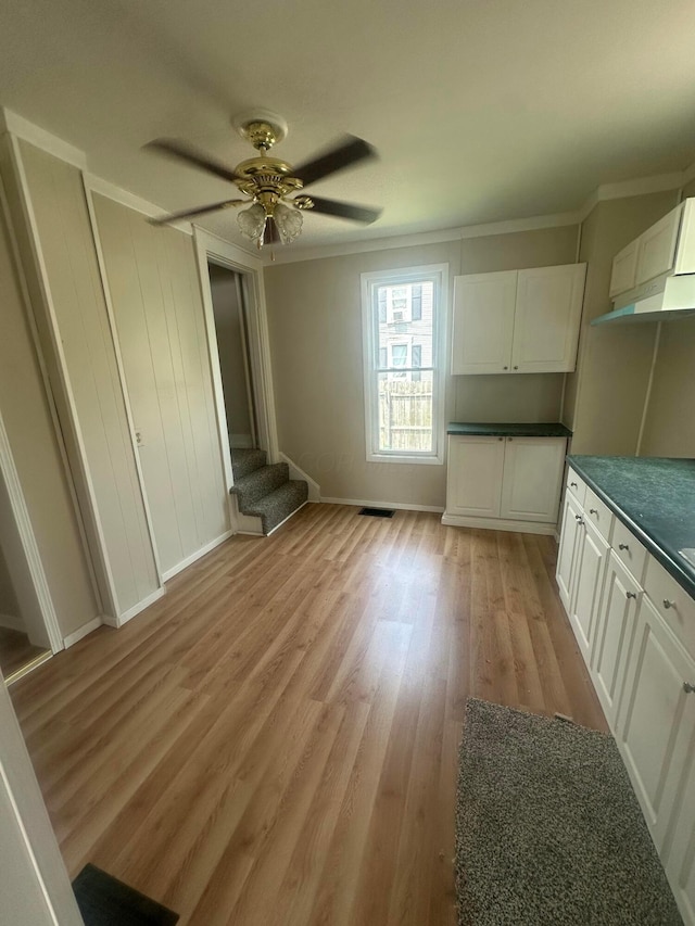 600 N Maple St, Lancaster, OH 43130 - unfurnished bedroom with ornamental molding, light wood-style floors, baseboards, and ceiling fan