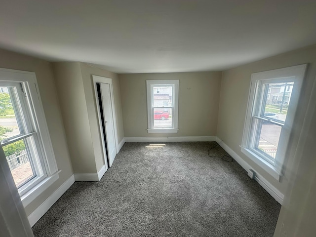 600 N Maple St, Lancaster, OH 43130 - spare room with dark colored carpet and baseboards