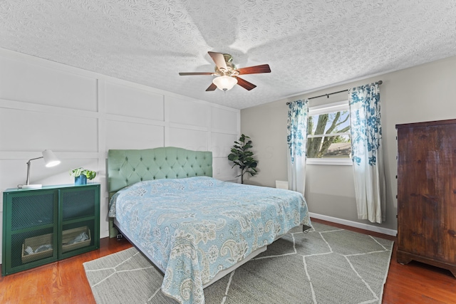 2147 Summit View Rd, Powell, OH 43065 - bedroom with wood finished floors, a ceiling fan, and a textured ceiling
