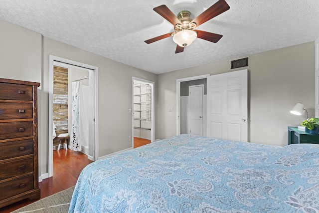 2147 Summit View Rd, Powell, OH 43065 - bedroom featuring wood finished floors, a textured ceiling, a ceiling fan, and baseboards