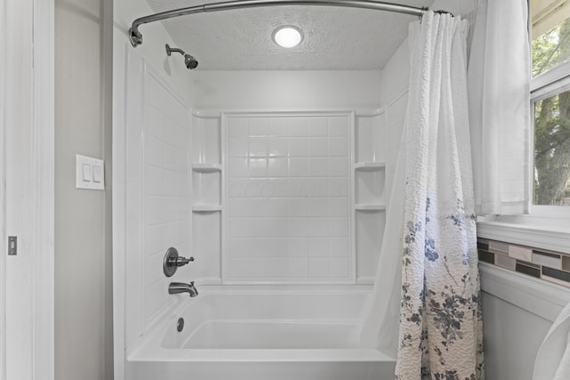 2147 Summit View Rd, Powell, OH 43065 - bathroom featuring a textured ceiling and shower / bath combo