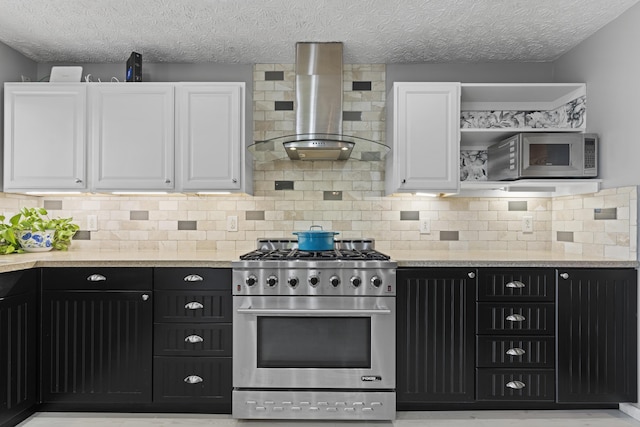 2147 Summit View Rd, Powell, OH 43065 - kitchen with appliances with stainless steel finishes, island exhaust hood, white cabinetry, dark cabinets, and a textured ceiling
