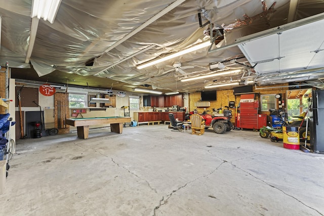 2147 Summit View Rd, Powell, OH 43065 - garage with a workshop area, a garage door opener, and freestanding refrigerator