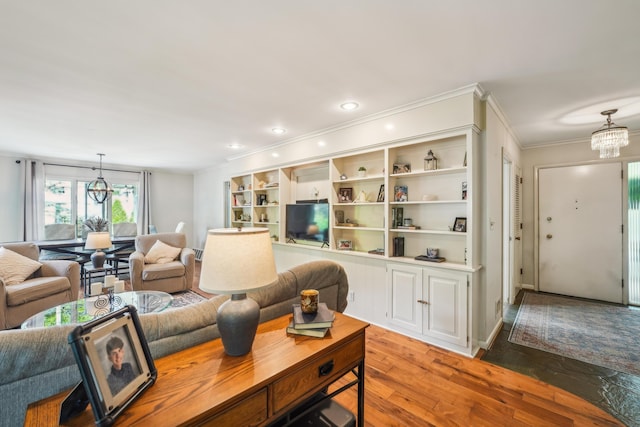 2171 Northam Rd, Columbus, OH 43221 - living area with a chandelier, light wood-style flooring, ornamental molding, and recessed lighting