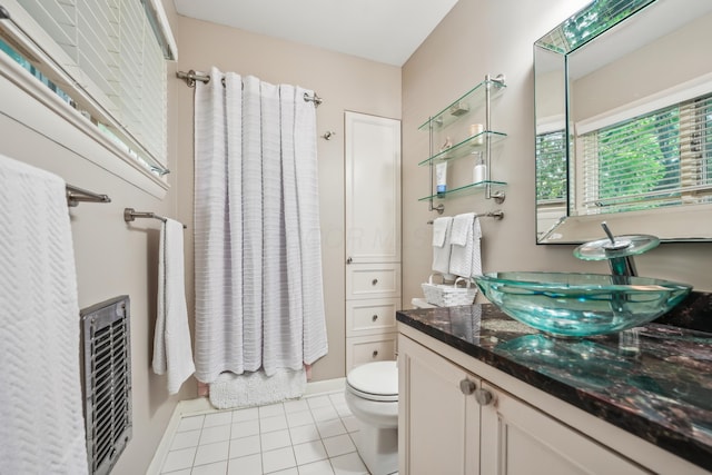 2171 Northam Rd, Columbus, OH 43221 - bathroom featuring tile patterned floors, vanity, toilet, and baseboards