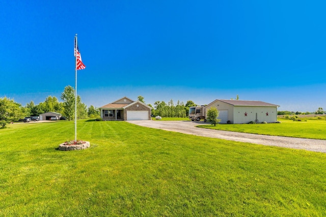 28275 Storms Rd, West Mansfield, OH 43358 - ranch-style house with a front yard and driveway