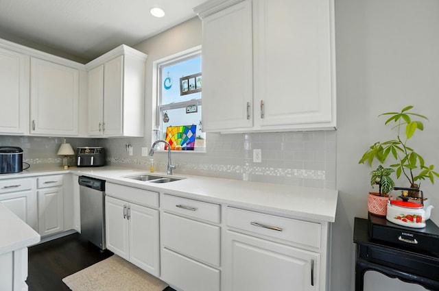 560 Green Forest Pl, Lithopolis, OH 43136 - kitchen featuring stainless steel dishwasher, tasteful backsplash, white cabinets, and light countertops