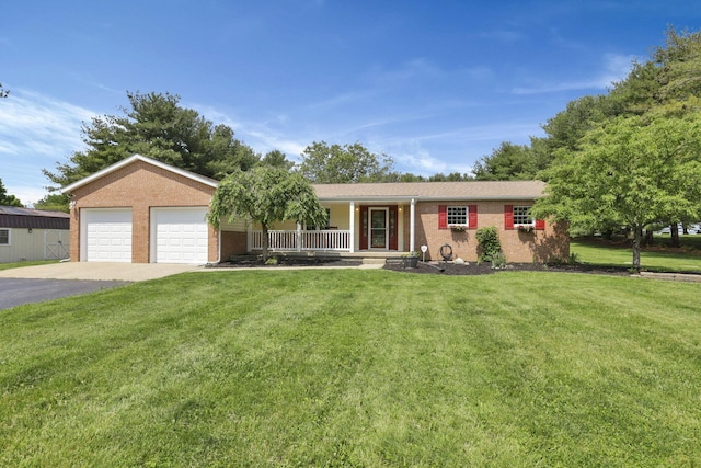 1915 Sitterley Rd, Canal Winchester, OH 43110 - ranch-style home with a porch, brick siding, asphalt driveway, and a front lawn